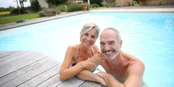 Active snowbird couple in community pool