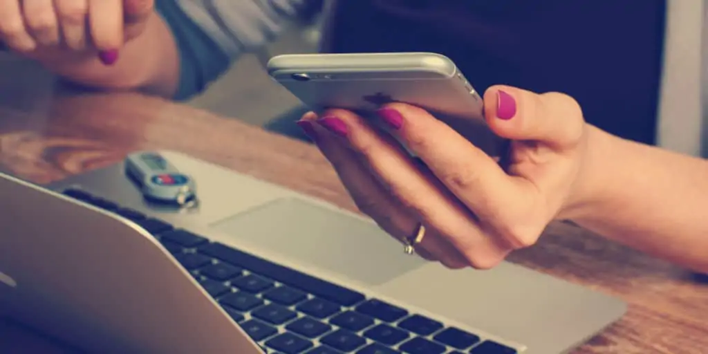 woman using phone for mobile banking