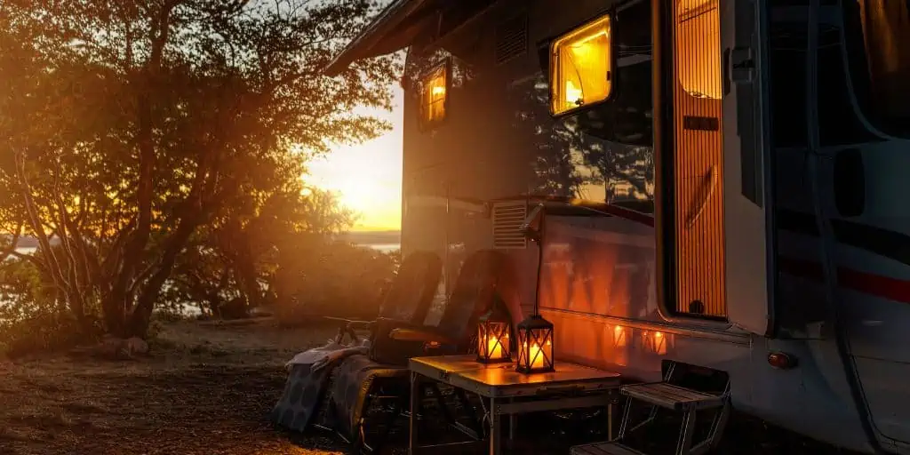 rv at campsite during sunset