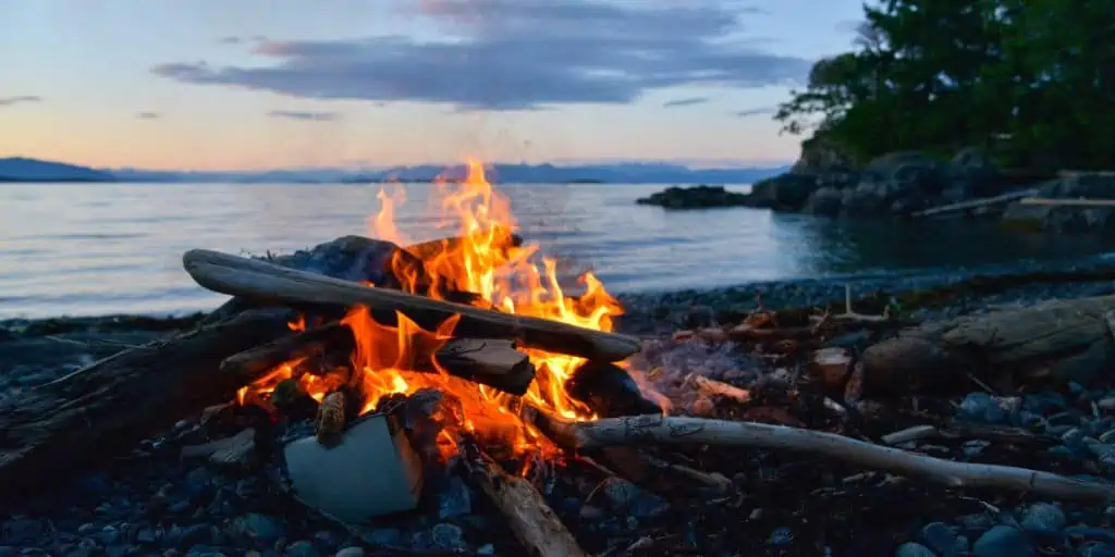 campfire at lakeside campsite