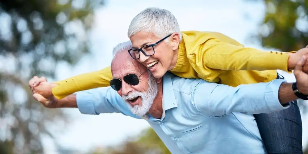 active senior couple having fun living the snowbird life